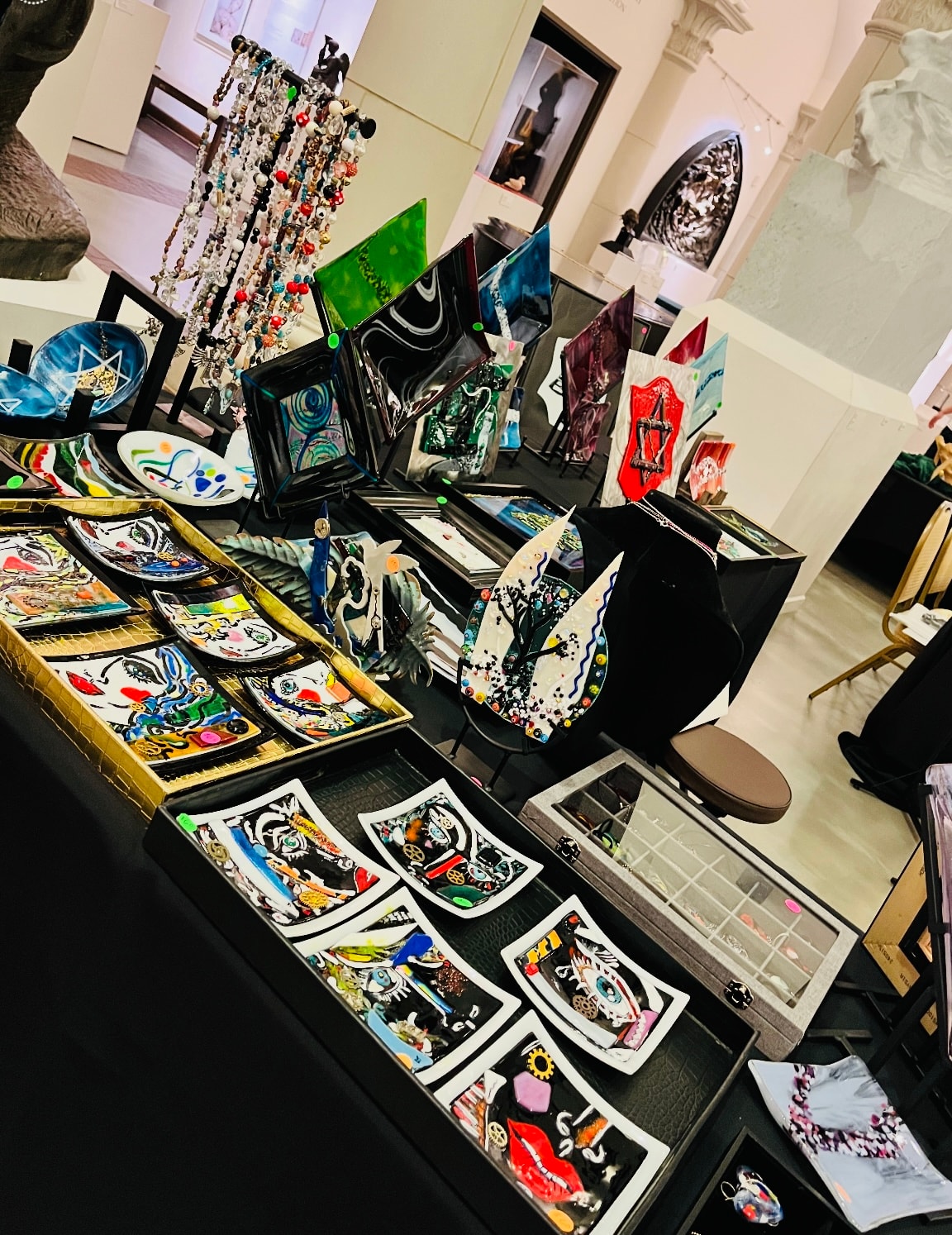 Full display of Cheri Toll's art at museum exhibition